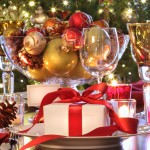 Elegant holiday table setting with red ribboned gift